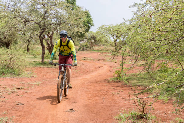 A cyclist in Uganda on a safari