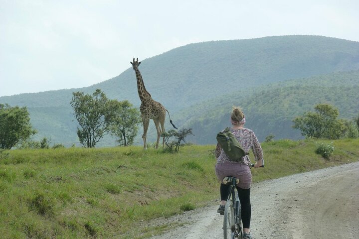 A woman doing a cycling safari in Kenya