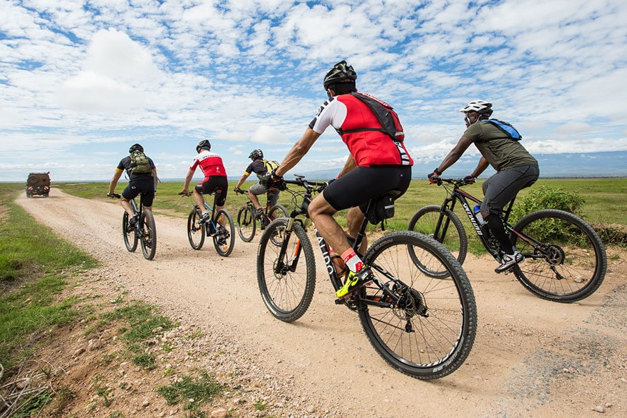 A group of cyclists on an adventure during their cycling safaris in Uganda